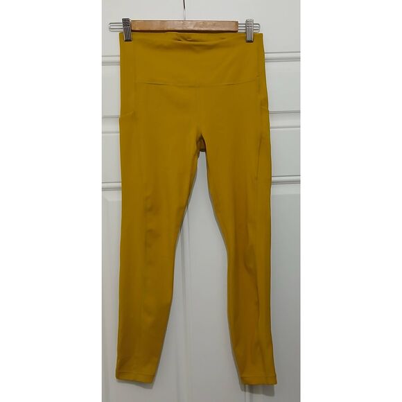 Athleta womens small ultimate stash phone pocket 7/8 leggings mustard yellow - Picture 1 of 8